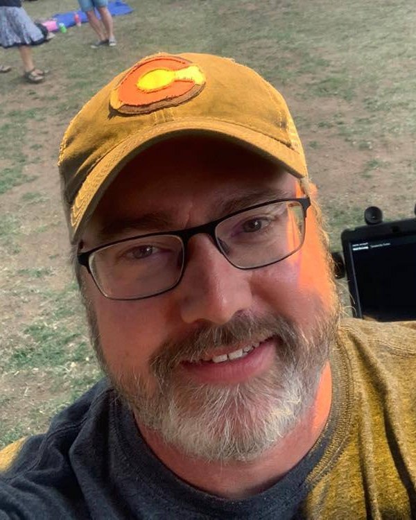 Lance Swearengin, smiling, in a Colorado cap
